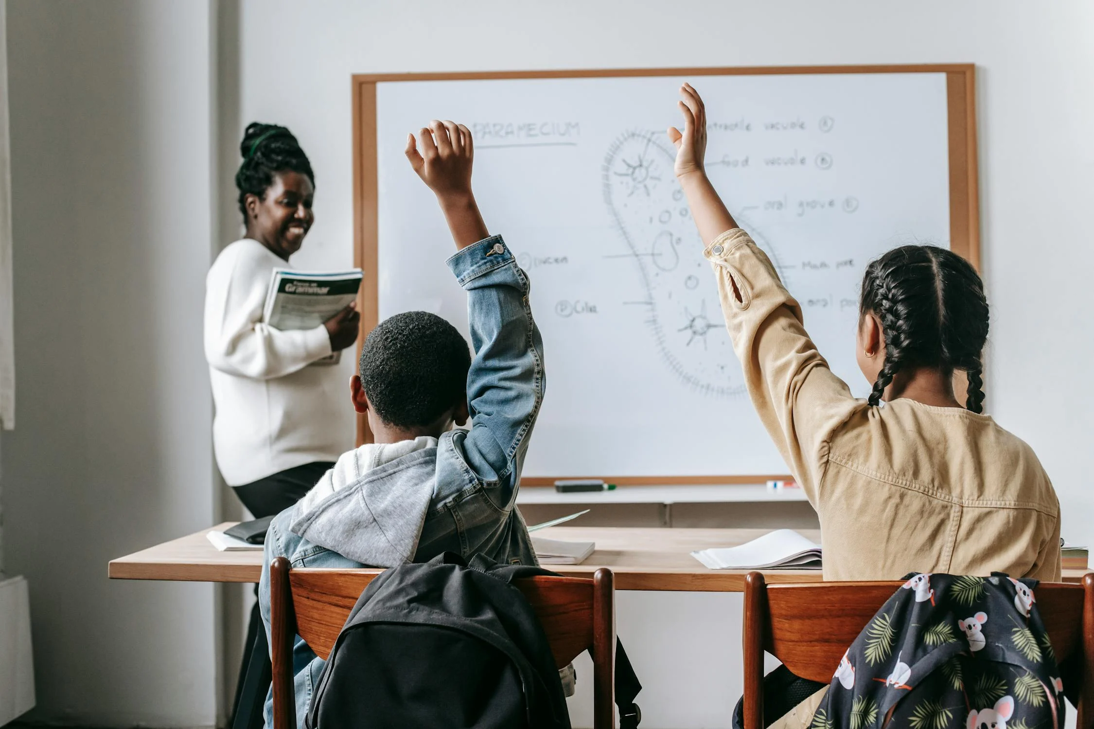 Black Woman with Pupils in Classroom