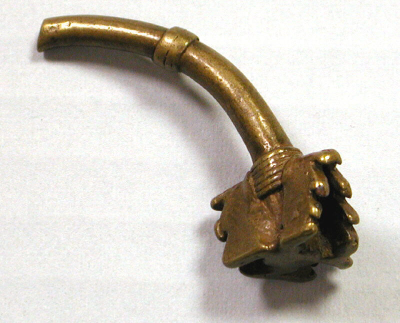An eighteenth- or nineteenth-century metal gold weight made by Akan peoples